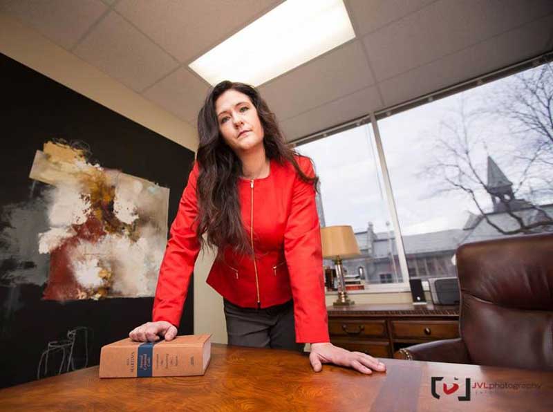 criminal defence lawyer Natasha Calvinho leaning against her desk